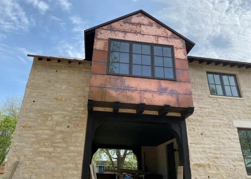 Copper metal panel facade on a stone building for Metal Roof Coating in Deerfield